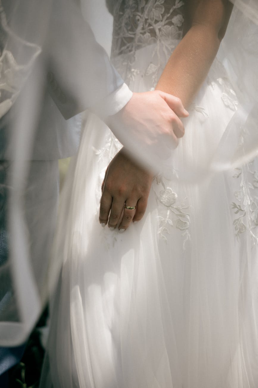 Couple holding hands during a quiet wedding moment in New Zealand